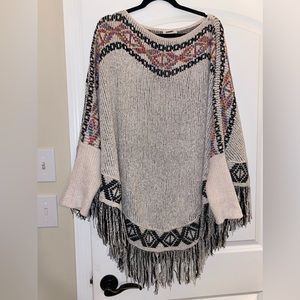 Beautiful fringe poncho. Velvety sweater material with beautiful details.O/S